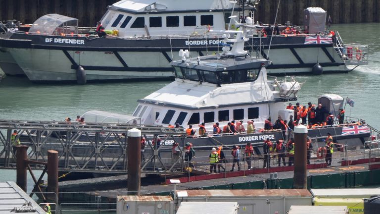 A group of people thought to be migrants are brought in to the Border Force compound in Dover, Kent. Pic: PA