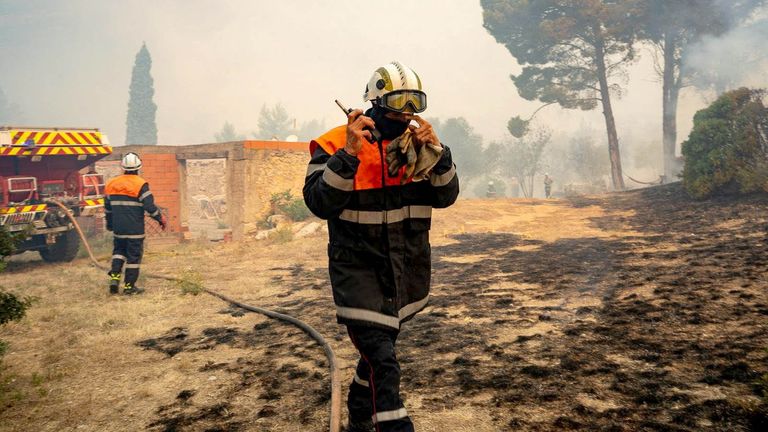 Firefighters working near the village of Saint-Laurent-de-la-Cabrerisse. Pic: Securite Civile/Reuters