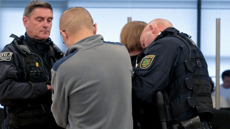 Defendant Jian G arrives in court. Pic: Reuters