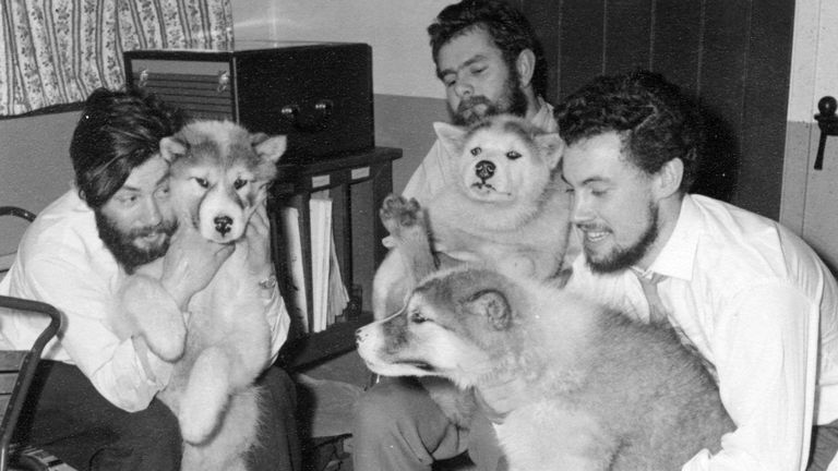 Dennis Bell, left, with dogs at the Admiralty Bay base in midwinter, 1959. (Photographer: unknown)