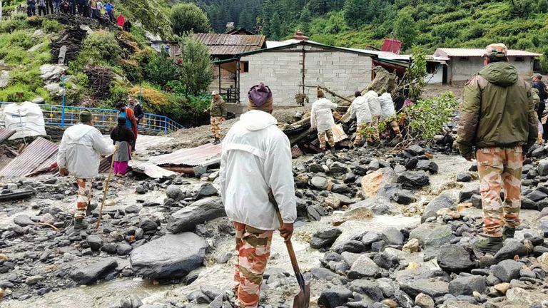 Indo-Tibetan Border Police asses the damage and rescue operation after a flash flood that swept away houses and buildings in Dharal.
Pic: AP