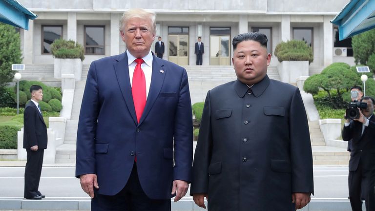 Trump and Kim at the demilitarized zone in June 2019. Pic: Reuters