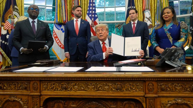 Donald Trump with the foreign ministers of the DRC (right) and Rwanda (left), Marco Rubio, and JD Vance. Pic: AP