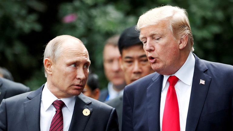 Donald Trump, right, and Vladimir Putin at a summit in Vietnam in 2017. Pic: Reuters