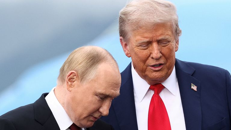 U.S. President Donald Trump speaks with Russian President Vladimir Putin, as they meet to negotiate for an end to the war in Ukraine, at Joi