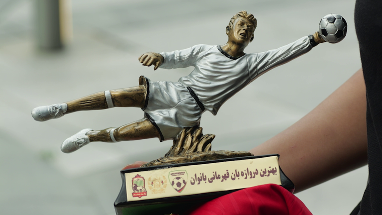 Elaha's only memento from home is a trophy from the Afghan championship