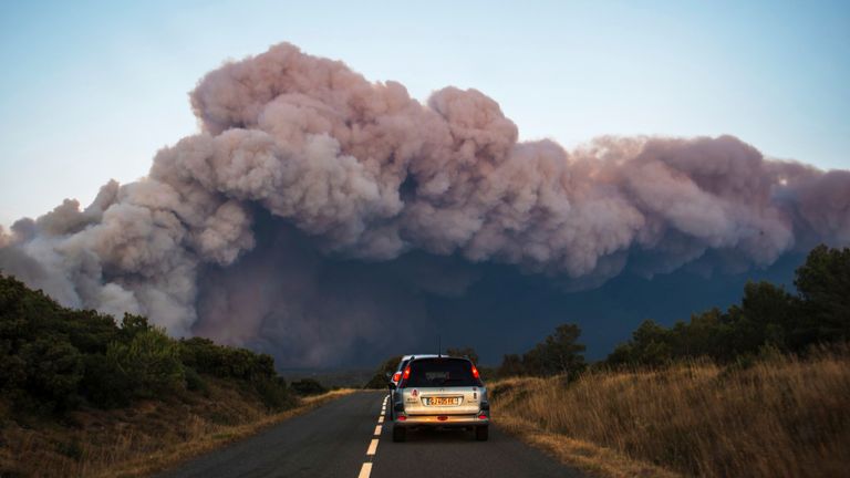 Smoke fills the air as the wildfire burns across southern parts. Pic: Richard Capoulade/AP