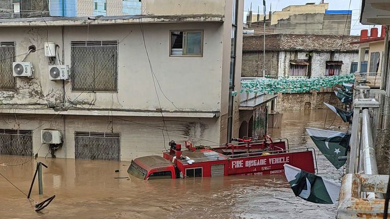A fire truck submerged in floodwater in Mingora, the main town of Swat Valley, northwestern Pakistan. Pic: AP