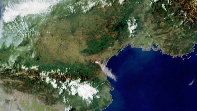 This aerial image shows smoke billowing across the region. Pic: Meteo France/AP