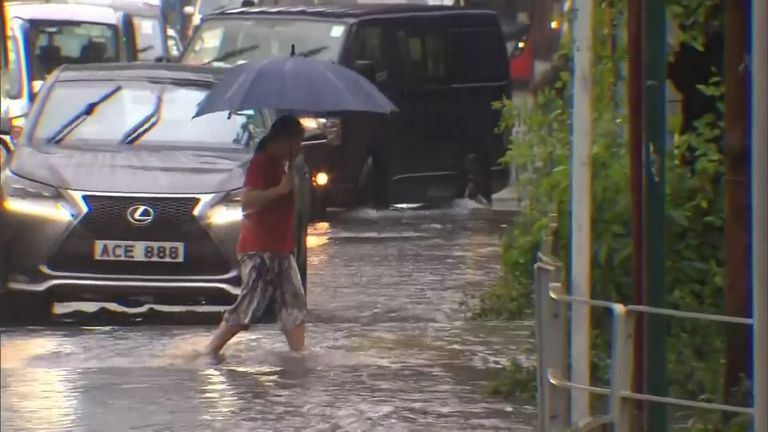 Hong Kong issued it's highest level 'black' storm warning, as torrential rains triggered floods and landslides