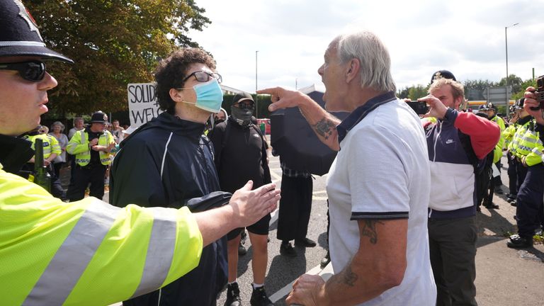 A confrontation between a protester and a counter-protester outside the Sheraton Four Points Hotel in Horley, Surrey. Pic: PA