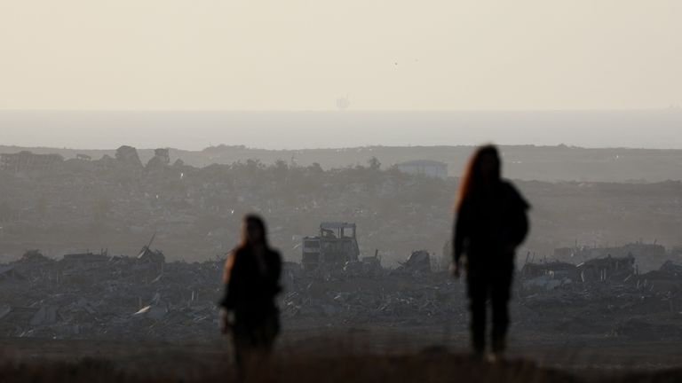 Israeli soldier overlooks the Gaza Strip, as seen from the Israeli side of the Israel-Gaza border