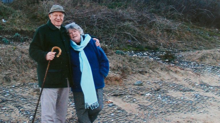 Jean Flick with her late husband on the beach below their home. Pic: PA