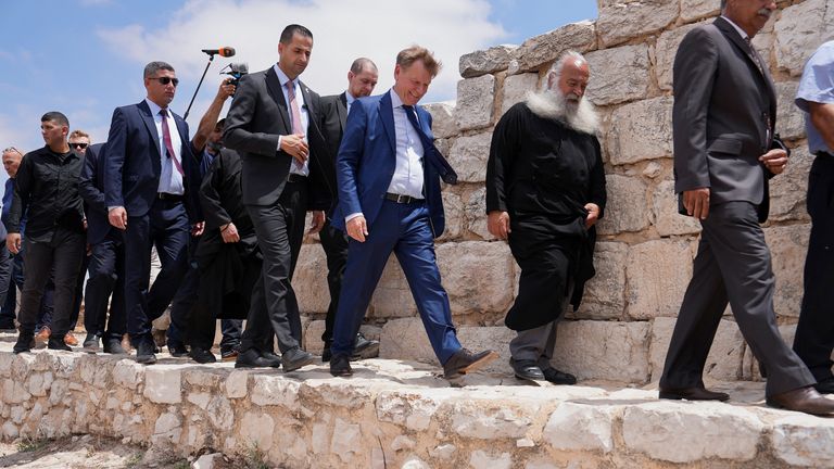 Germany's Foreign Minister Johann Wadephul on a visit to a Christian village in the Israeli-occupied West Bank this month. Pic: Reuters