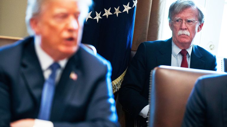 John Bolton listens as President Donald Trump speaks during a cabinet meeting in April 2018. Pic: AP. 