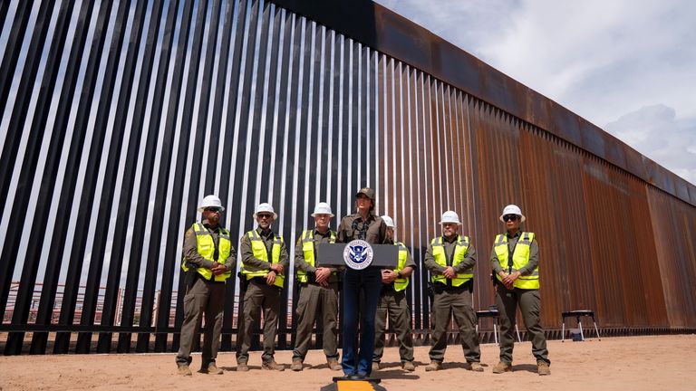 Ms Noem says the black paint will "make it even harder for people to climb" the wall. Pic: Kristi Noem/X
