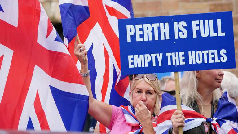 People demonstrating at an Abolish Asylum System protest outside the Radisson Hotel in Perth, Scotland. Pic: PA