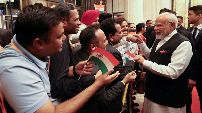 India's Prime Minister Modi is welcomed by the Indian community upon his arrival in Tianjin, China. Pic: Reuters