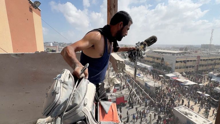 A man holds the equipment used by Palestinian cameraman Hussam al Masri. Pic: Reuters