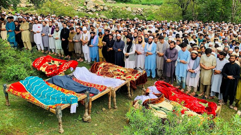 Locals attend the funeral of victims of flooding in Jibrari village, Salarzai Tehsil, in northern Pakistan. Pic: Reuters