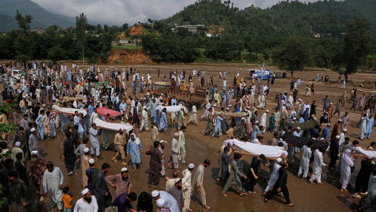 Funerals take place for victims of the flooding in Buner, Pakistan on Saturday. Pic: AP
