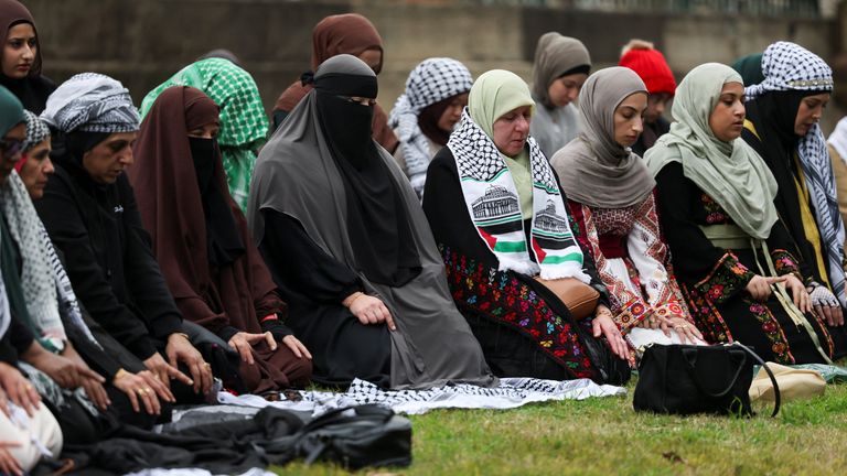 Women pray during the protests on 24 August. Pic: Reuters