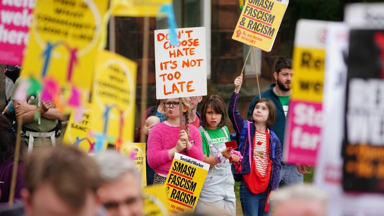 People take part in a counter-protest outside the Radisson Hotel in Perth. Pic: PA