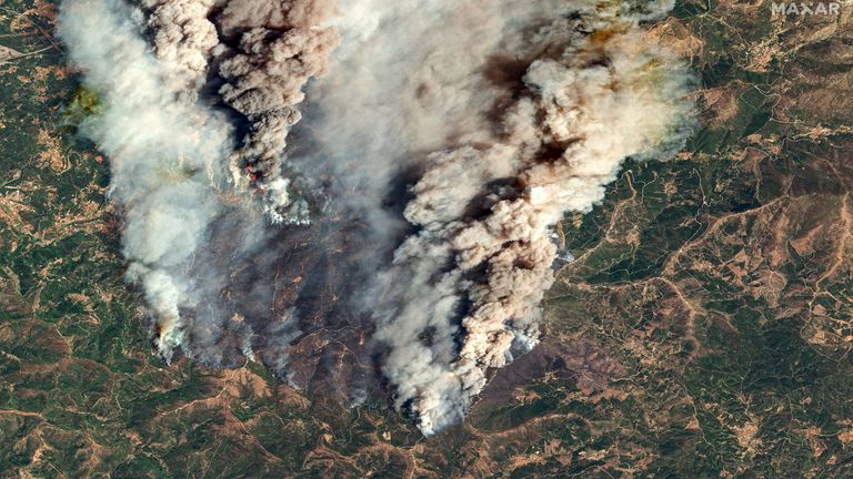 A satellite image shows smoke from wildfires in Piodao, Portugal.
Pic: Maxar/Reuters