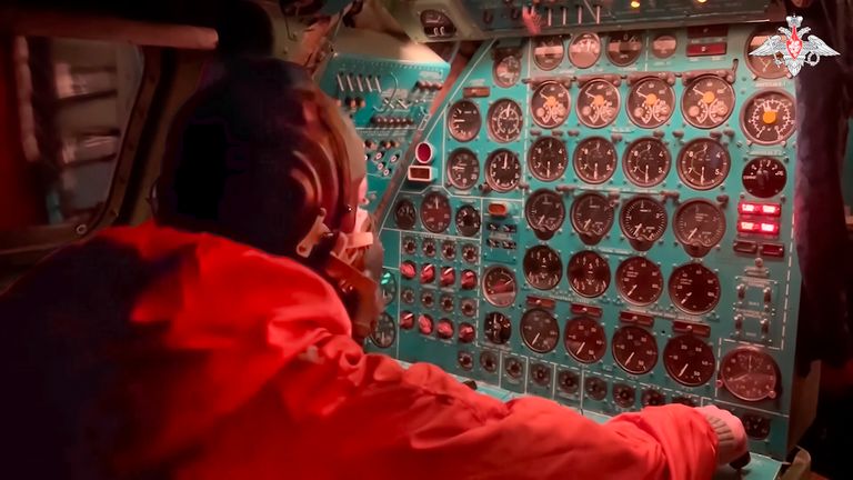 Russian air force crew member oversees an instrument panel on board a Tu-95 nuclear-capable strategic bomber 