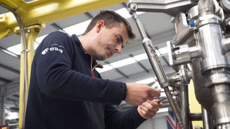 A Skyrora engineer works on one of the company's rockets in 2023
