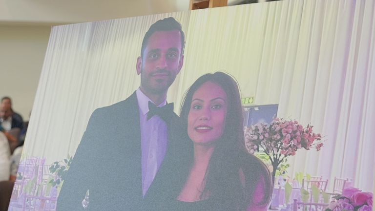 A photo of Sunny and Monali Patel, who died in the Air India plane crash, on display at a vigil