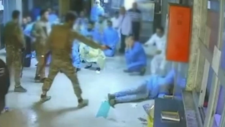 A second man fires with a handgun