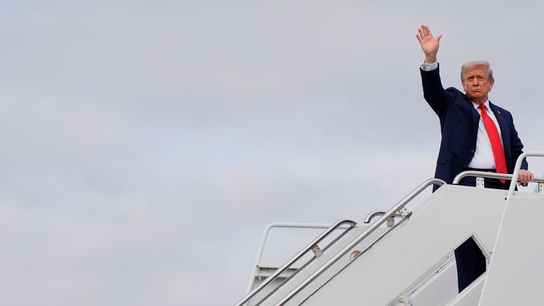 President Trump waves goodbye as he boards Air Force One after the meeting. Pic: Julia Demaree Nikhinson/PA