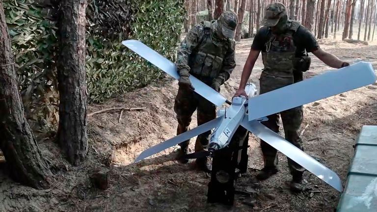 Russian soldiers prepare to launch a Lancet drone in an undisclosed location in Ukraine. Pic: Russian Defence Ministry Press Service/AP