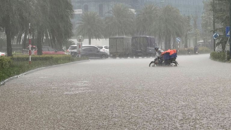 Streets of the capital city, Hanoi, are flooded due to heavy rain after Typhoon Kajiki passed through Vietnam. Pic: AP/Hau Dinh