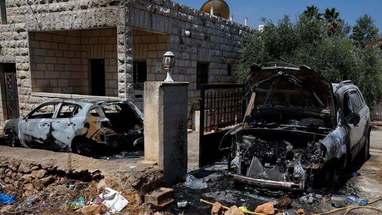 Burnt cars are seen after an attack by Israeli settlers near Ramallah in the Israeli-occupied West Bank. Pic: Reuters/Ammar Awad 
