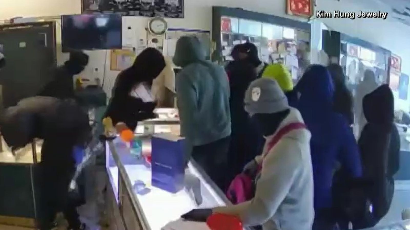 CCTV shows at least 15 masked robbers carry out smash-and-grab raid at California jewellery store