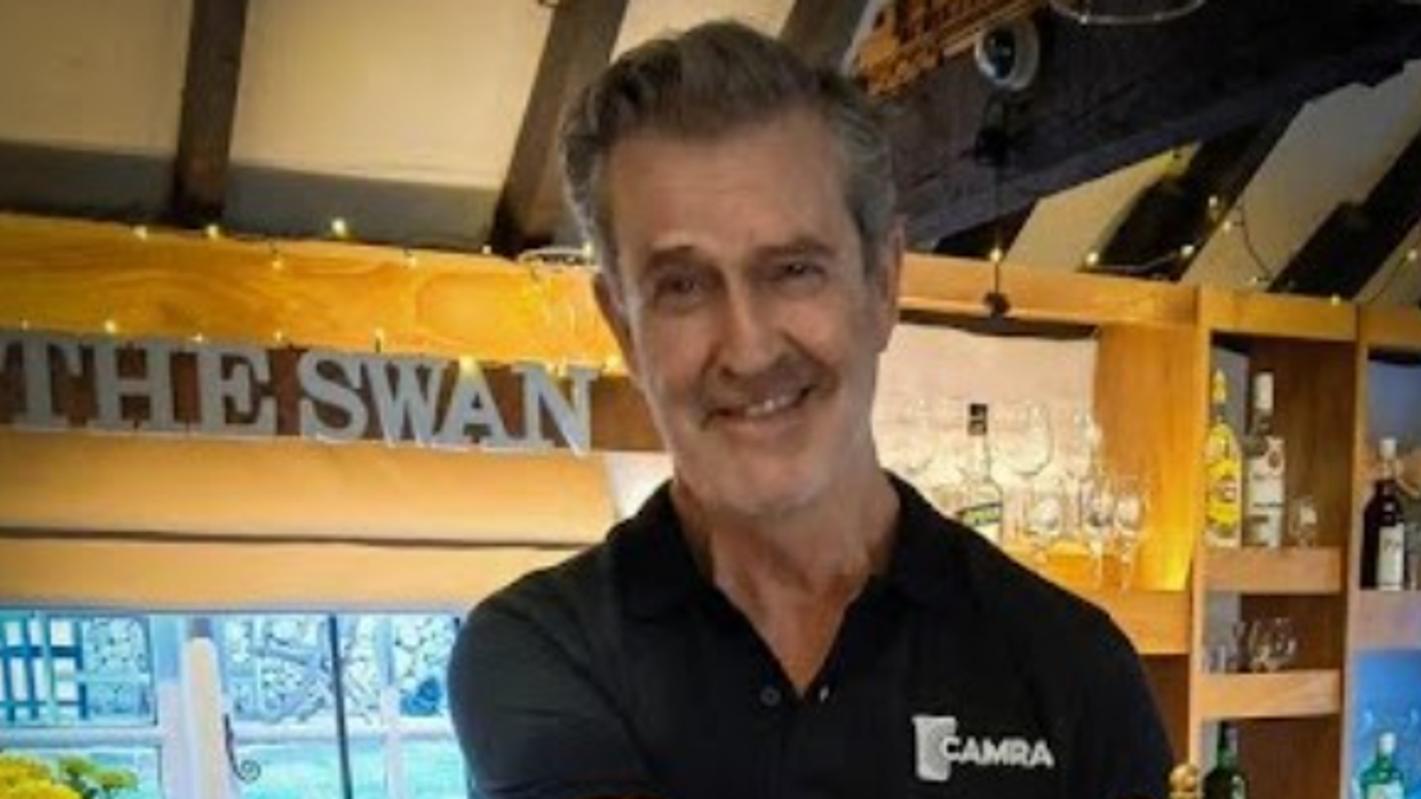 Hollywood star Rupert Everett spotted working behind bar of village pub