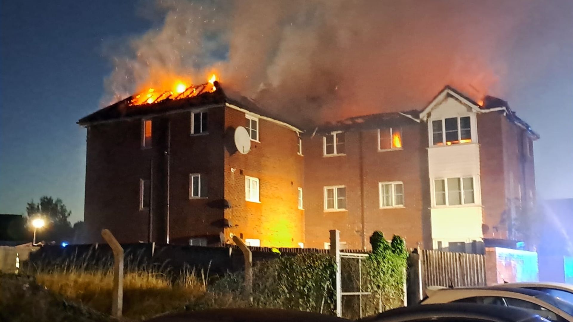 Three children taken to hospital after fire tears through three-storey block of flats
