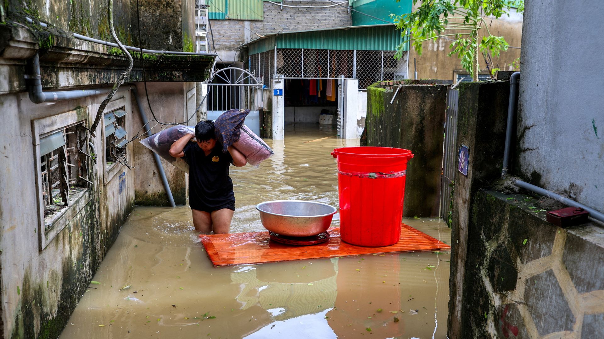 Torrential rain after Vietnam typhoon leaves at least 19 dead amid flooding and landslides