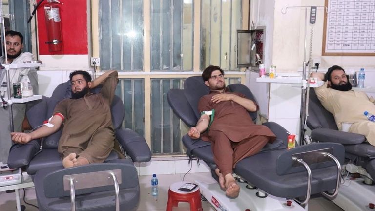 Afghans donate blood for quake victims. Afghanistan Ministry of Public Health/AP