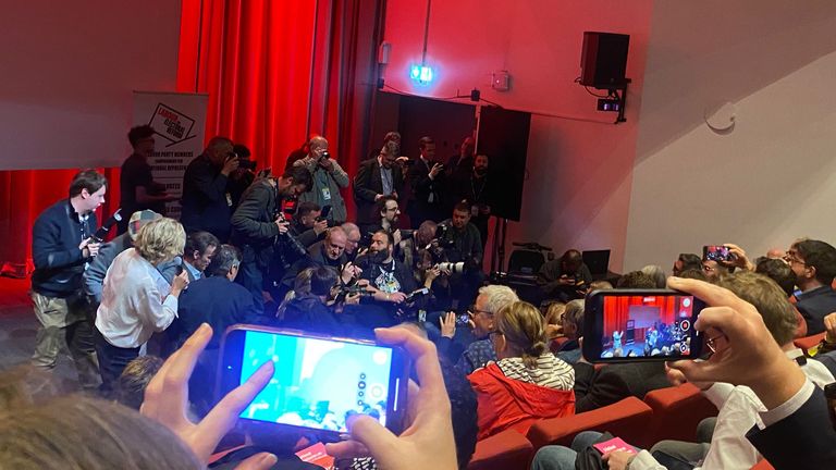 Andy Bunrham flanked by media at a fringe event 