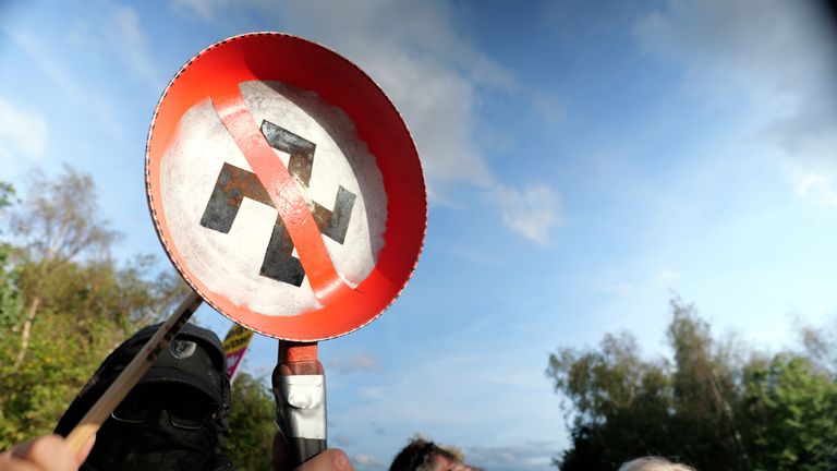 A sign held up by counter-protesters
