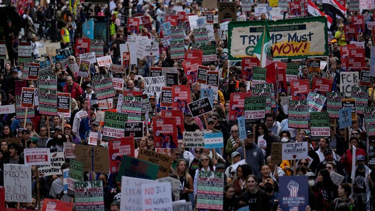 A protest against threatened immigration raids in Chicago on Saturday. Pic: AP