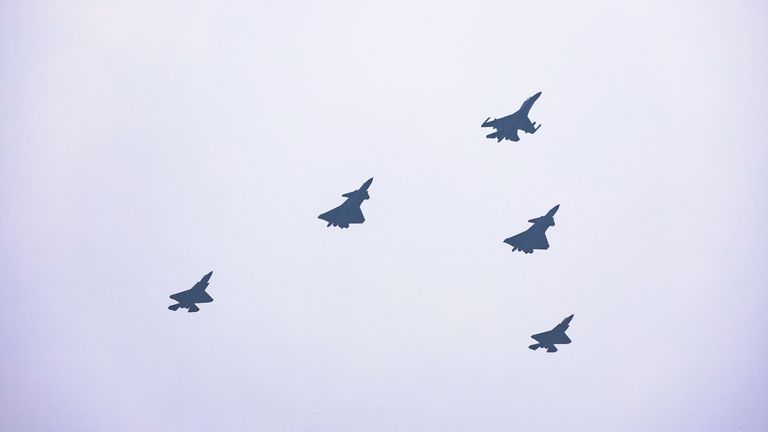 J-16D, J-20, and J-35A fighter jets fly over Tiananmen Square. Pic: Reuters