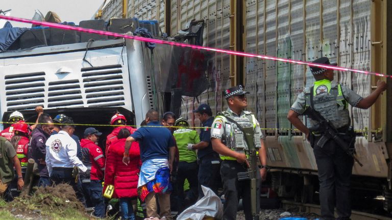 The rear half of the bus was pushed by the train further down the tracks. Pic: Reuters