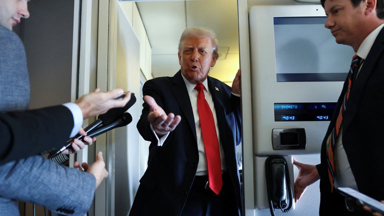 The president speaks to reporters on his way over. Pic: Reuters