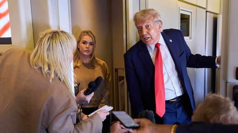 President Donald Trump speaks with reporters after departing the United Kingdom, Thursday, Sept. 18, 2025, aboard Air Force One. (AP Photo/Evan Vucci)
