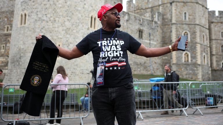 A supporter of Trump stood outside Windsor Castle ahead of the parade