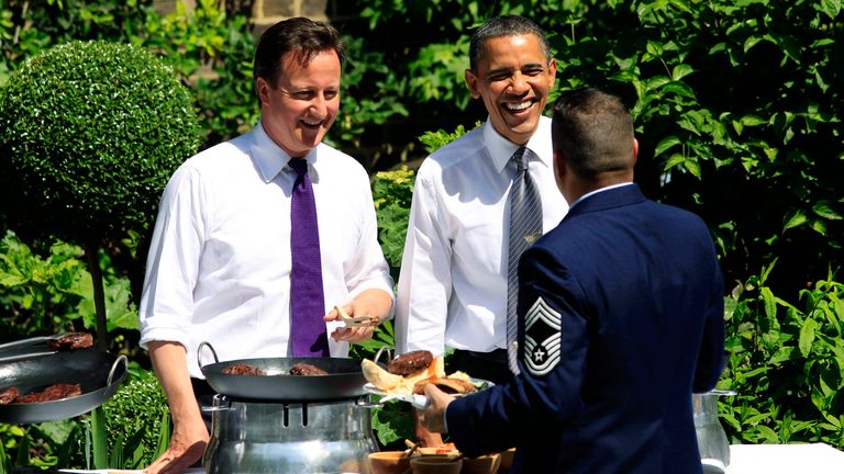 Cameron and Obama serve food at a barbecue in the garden of 10 Downing Street. Pic: Reuters
